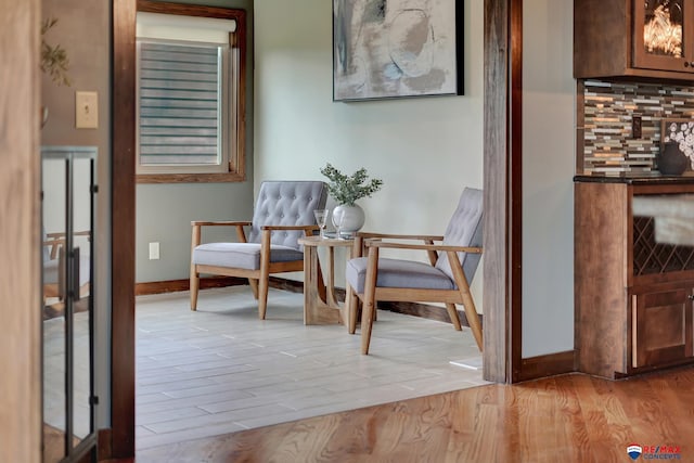 sitting room featuring light hardwood / wood-style flooring