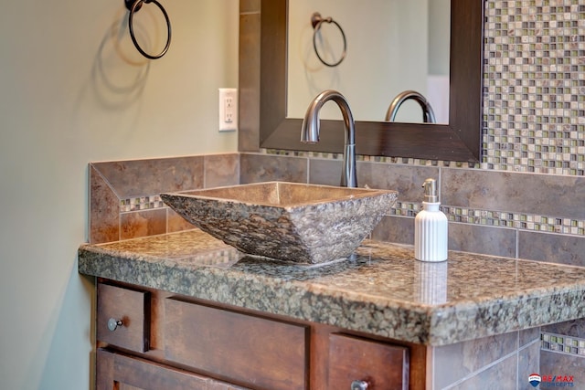 interior details featuring tasteful backsplash and vanity