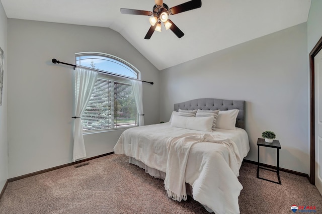 carpeted bedroom with ceiling fan and lofted ceiling