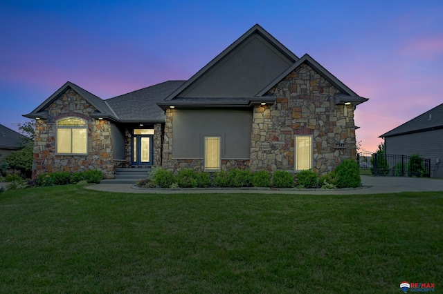 french provincial home with a yard