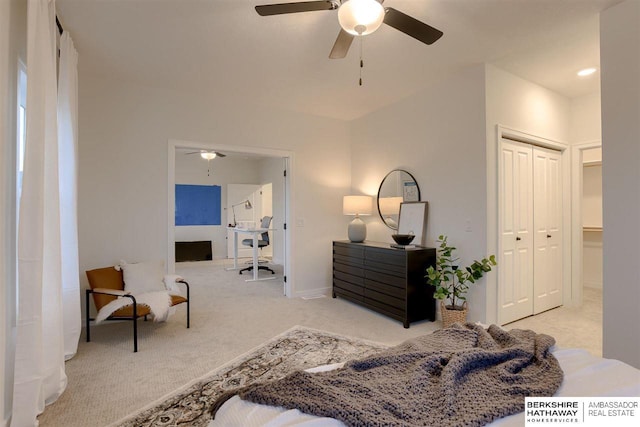 carpeted bedroom featuring ceiling fan and a closet