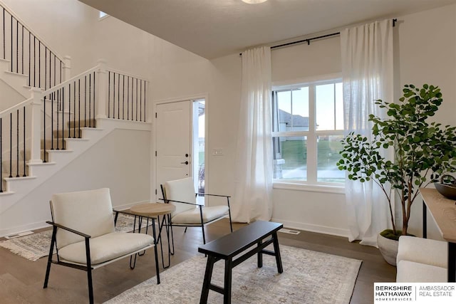 sitting room with hardwood / wood-style flooring