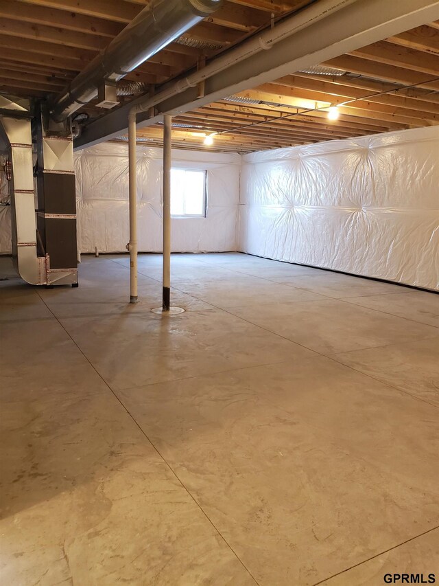 basement featuring heating unit