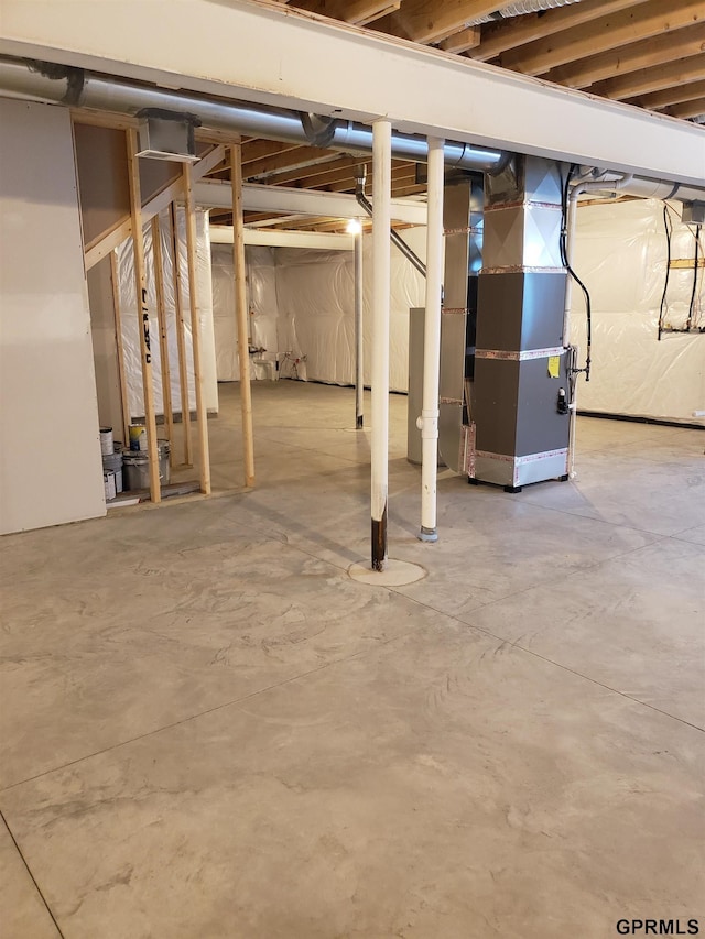 basement featuring heating unit