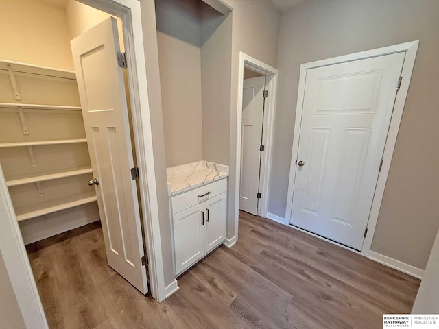 hall with light hardwood / wood-style floors