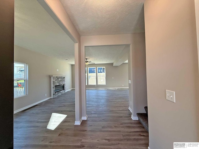 interior space featuring dark hardwood / wood-style flooring and a textured ceiling