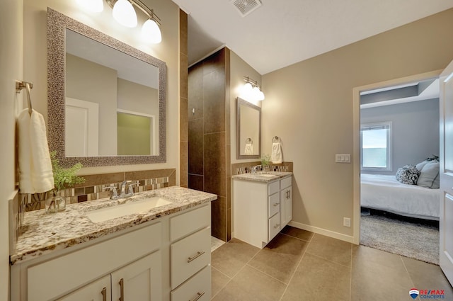 bathroom with tile patterned floors and vanity