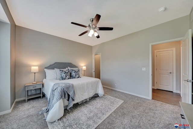 bedroom with ceiling fan and light carpet