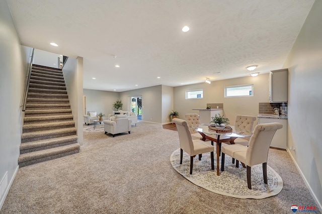 dining area with light carpet