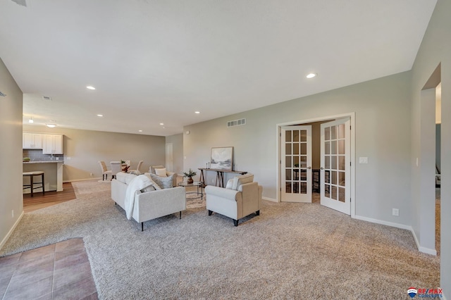 carpeted living room featuring french doors