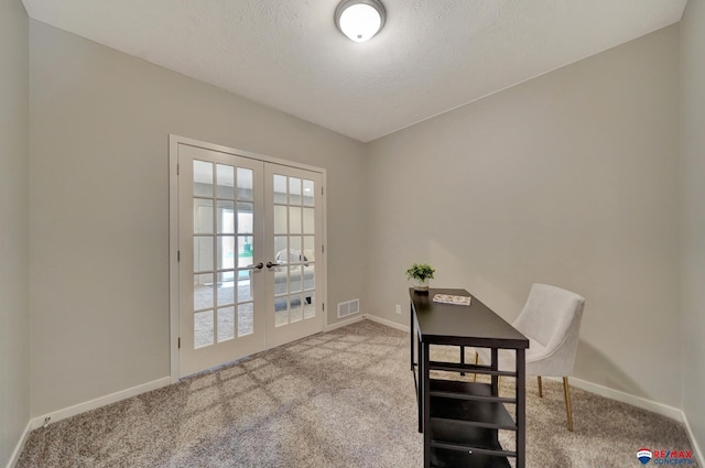 office space with light carpet, french doors, and a textured ceiling