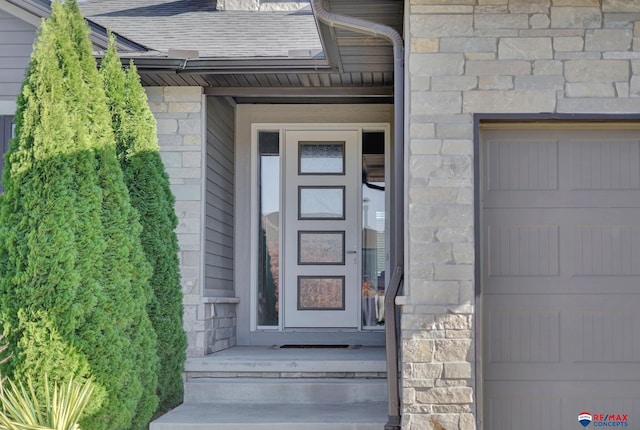 property entrance with a garage