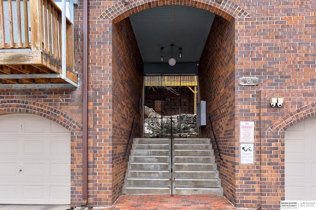 doorway to property featuring a garage