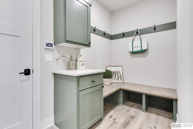 mudroom with light hardwood / wood-style floors