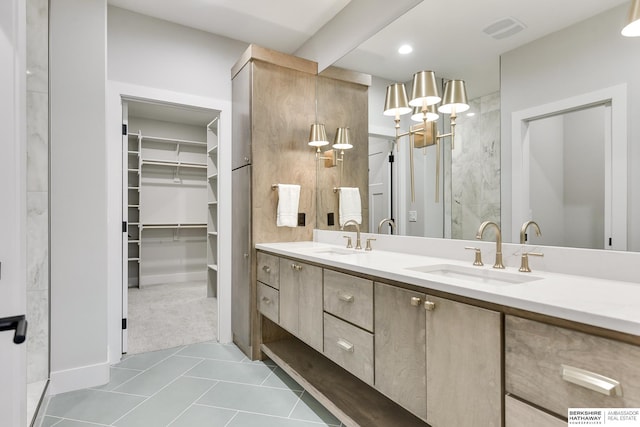 bathroom with vanity and tile patterned floors