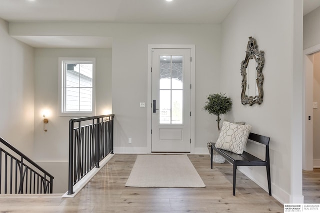 foyer entrance with light hardwood / wood-style flooring