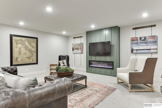 living room with a fireplace and carpet floors