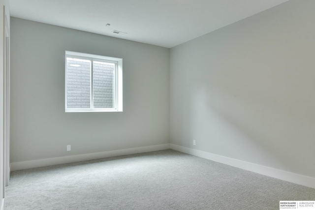 spare room with carpet flooring