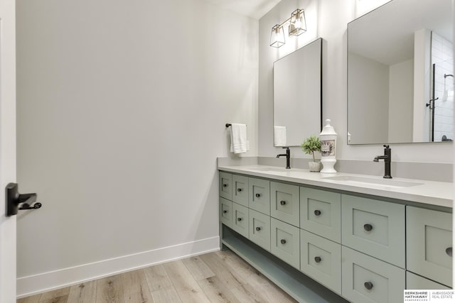 bathroom featuring vanity and wood-type flooring