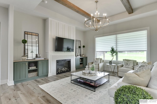 living room featuring beam ceiling, light wood-type flooring, and a chandelier