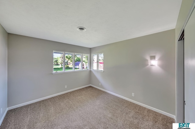 view of carpeted spare room