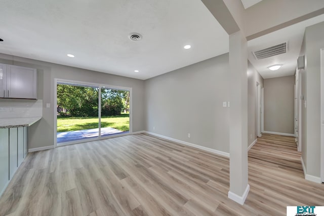 unfurnished living room featuring light wood-type flooring