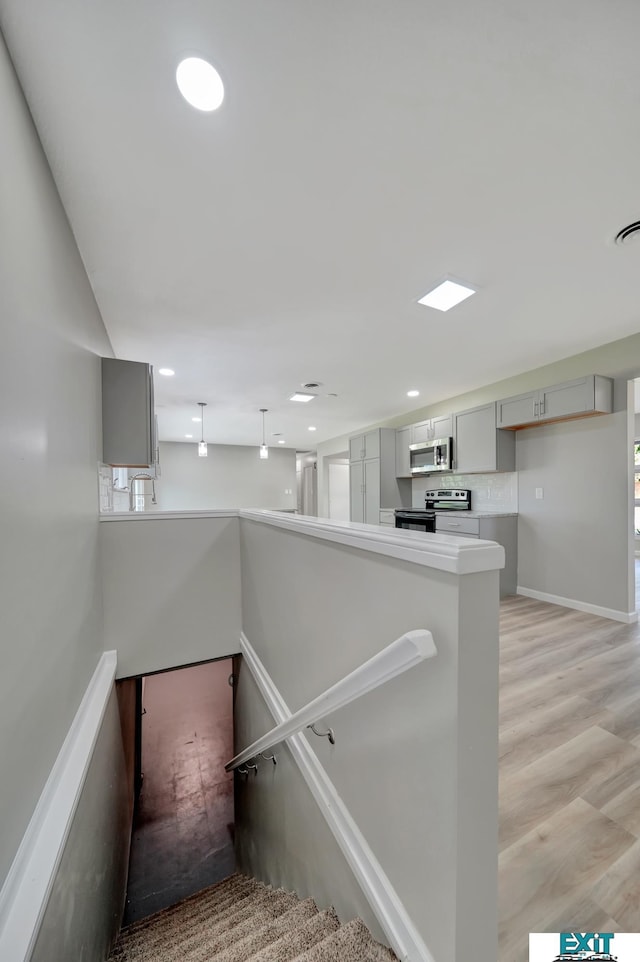 staircase featuring hardwood / wood-style flooring