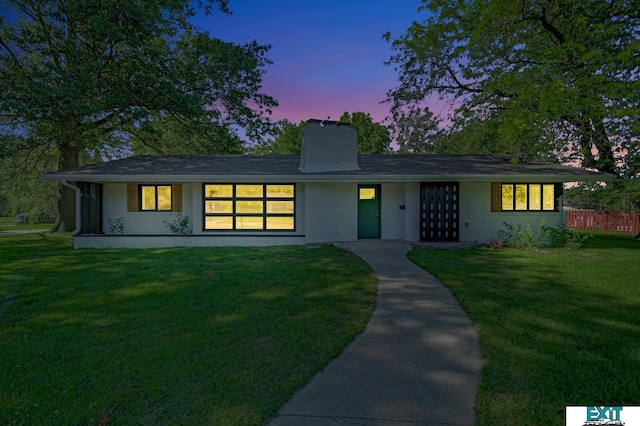 view of front of home featuring a yard