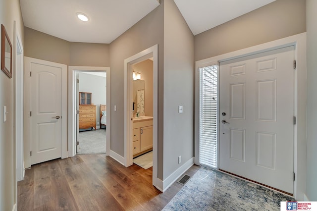 foyer with hardwood / wood-style floors