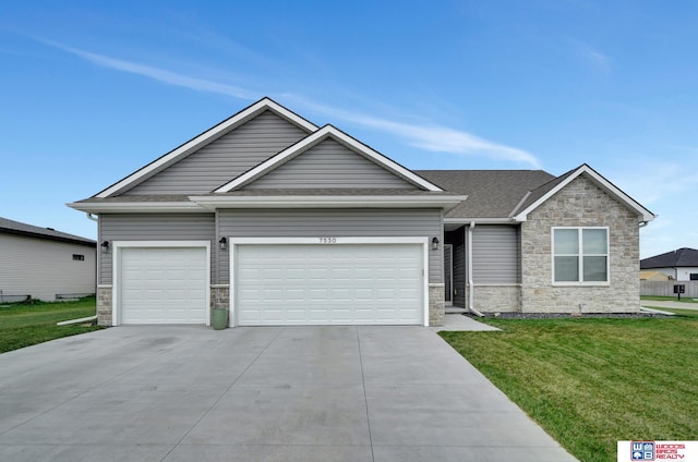 view of front of home featuring a garage and a front yard