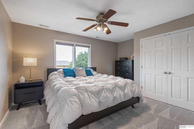 bedroom featuring carpet floors, a closet, and ceiling fan