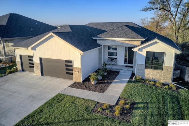 contemporary home with a front lawn and central AC unit