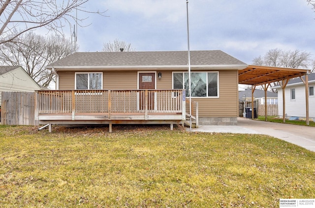 view of front facade featuring a carport, a deck, and a front yard