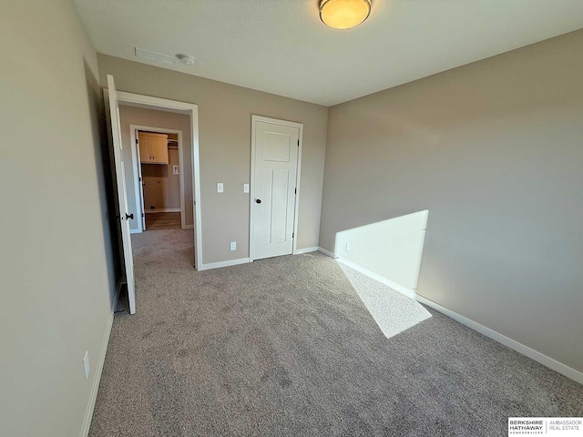 unfurnished bedroom with carpet flooring