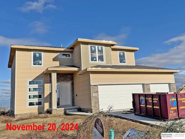 view of front of home with a garage