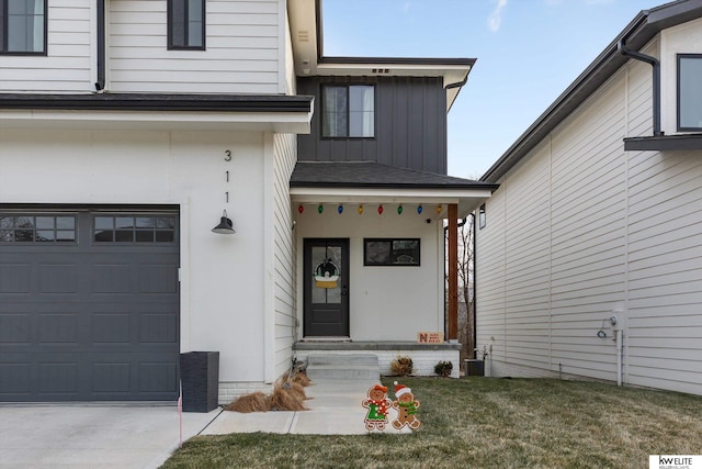 property entrance featuring central AC unit and a garage