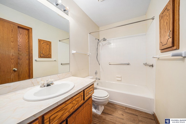 full bathroom featuring shower / bathing tub combination, hardwood / wood-style floors, vanity, and toilet