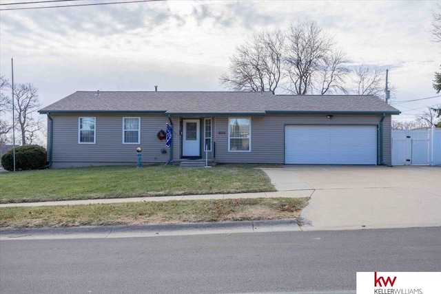 ranch-style home with a front yard and a garage