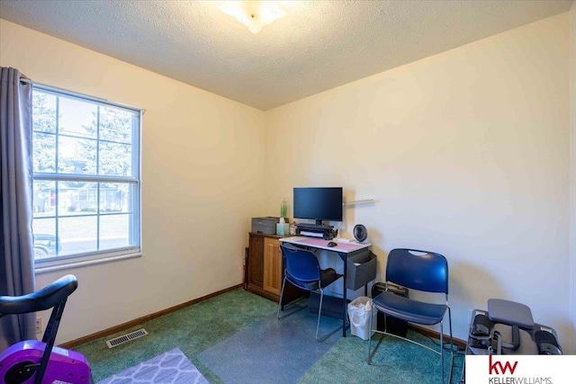 office area featuring a textured ceiling