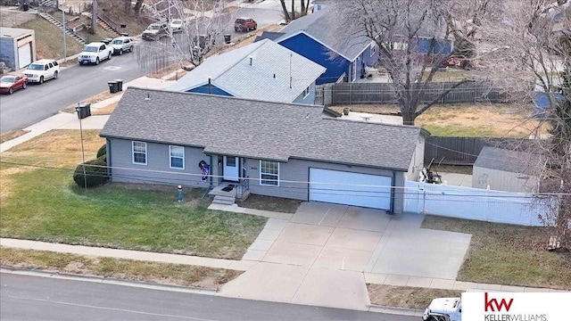 view of front facade featuring a garage and a front lawn