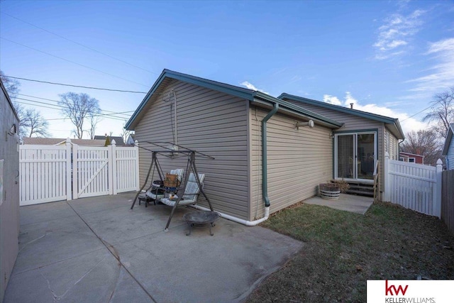 view of side of property featuring a patio