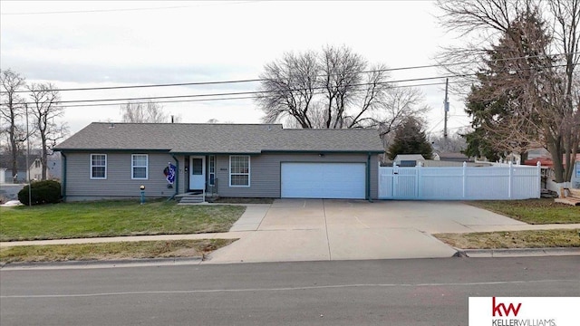 view of front facade with a garage and a front lawn