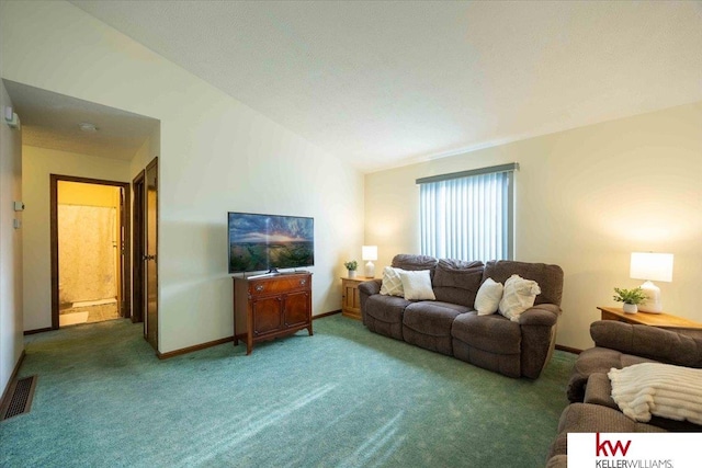 living room featuring carpet and lofted ceiling