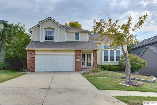 view of front of house featuring a front yard and a garage