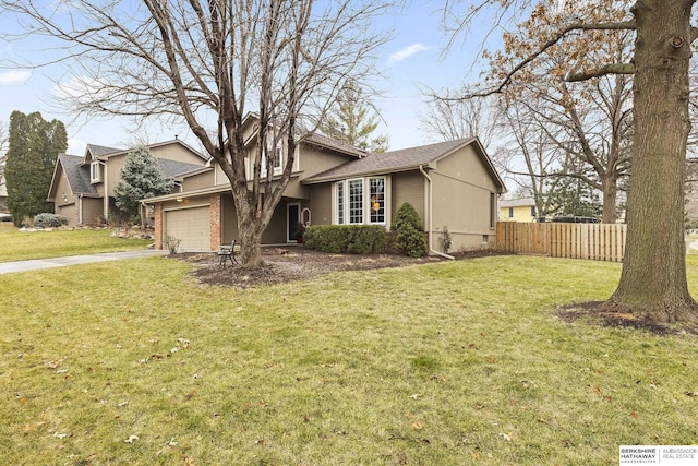 view of front of property with a front yard and a garage