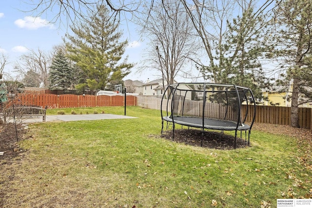 view of yard featuring a patio and a trampoline