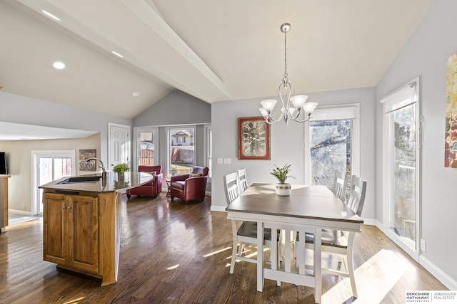 dining area with sink, dark hardwood / wood-style flooring, vaulted ceiling with beams, and a chandelier