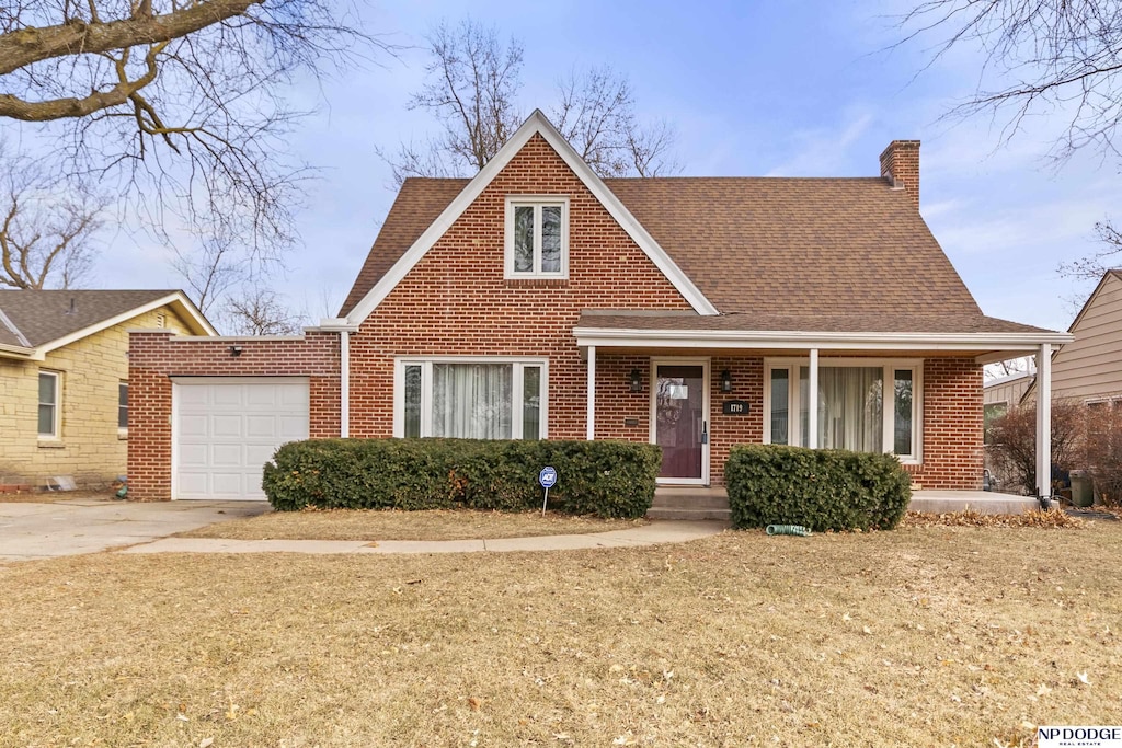 view of front facade with a front yard and a garage