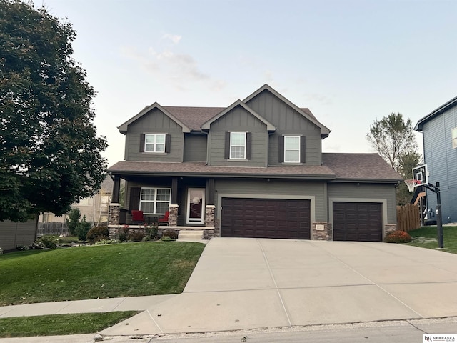 craftsman-style home with a garage and a front yard