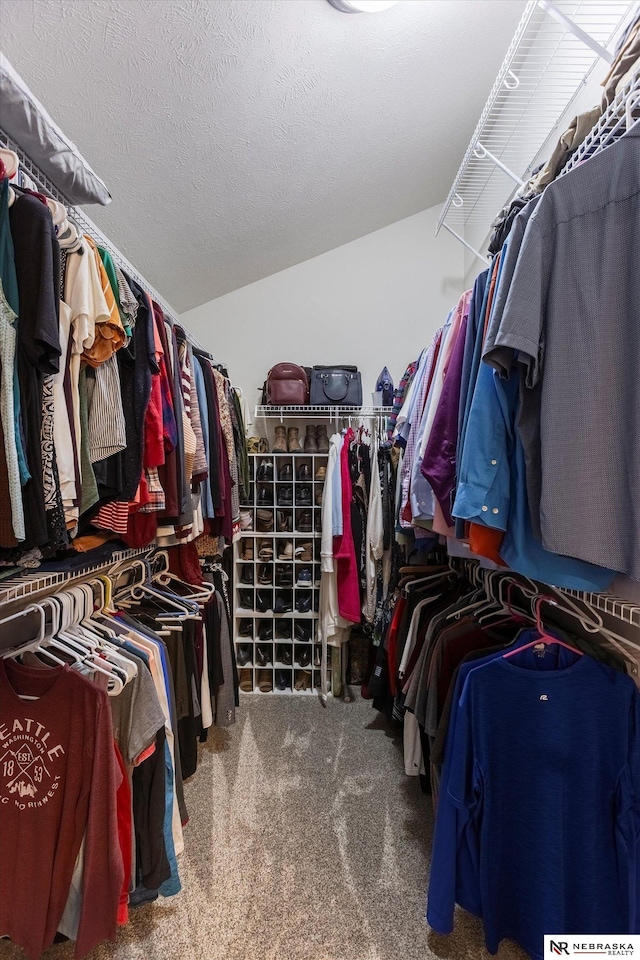 spacious closet featuring carpet and lofted ceiling